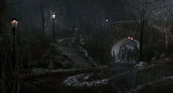 Movie still from “Home Alone 2: Lost in New York” (1992), directed by Chris Columbus – A night scene of a bridge and stairs in the dark; Extreme Wide shot, High angle