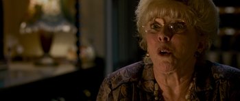 An older woman with a surprised look on her face