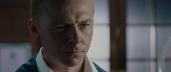 Movie still from “Hot Fuzz” (2007), directed by Edgar Wright – A person with blond hair; Close Up shot, Low angle