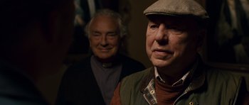 Movie still from “Hot Fuzz” (2007), directed by Edgar Wright – Two older men standing next to each other in a room; Close Up shot, Over the shoulder angle