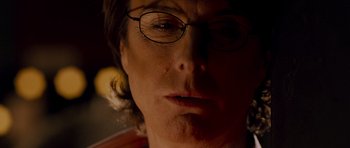 Movie still from “Hot Fuzz” (2007), directed by Edgar Wright – A person wearing glasses; Close Up shot, Over the shoulder angle