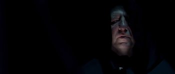 Movie still from “Hot Fuzz” (2007), directed by Edgar Wright – A person in a dark room; Close Up shot, Low angle