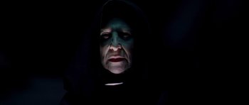 Movie still from “Hot Fuzz” (2007), directed by Edgar Wright – An old woman with a black hood is looking at the camera; Close Up shot, Low angle