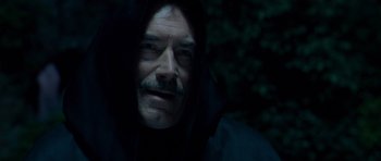 Movie still from “Hot Fuzz” (2007), directed by Edgar Wright – A person wearing a hooded shirt; Close Up shot, Low angle