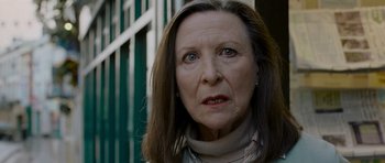 Movie still from “Hot Fuzz” (2007), directed by Edgar Wright – An older woman is looking directly at the camera; Close Up shot, Low angle