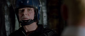 Movie still from “Hot Fuzz” (2007), directed by Edgar Wright – A man in a police uniform wearing a helmet; Close Up shot, Low angle