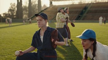 Movie still from “A League of Their Own” (2022), created by Abbi Jacobson – A group of women playing a game of baseball; Medium shot, High angle