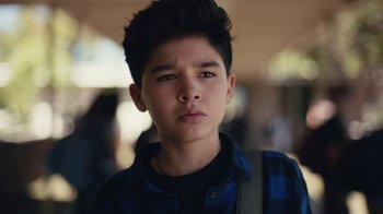 Movie still from “Euphoria” (2019), created by Sam Levinson – A young man with a backpack is looking at the camera; Close Up shot, High angle