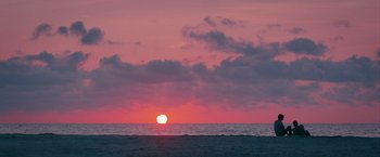 Movie still from “Hot Summer Nights” (2017), directed by Elijah Bynum – The sun is setting over the ocean as the sun sets; Extreme Wide shot, Low angle