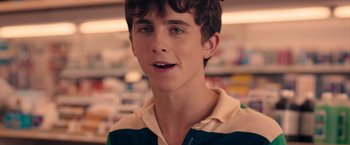 Movie still from “Hot Summer Nights” (2017), directed by Elijah Bynum – A young man is looking into the camera; Close Up shot, Over the shoulder angle