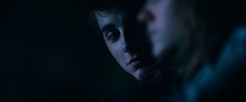 Movie still from “Hot Summer Nights” (2017), directed by Elijah Bynum – A young man is looking into the dark; Extreme Close Up shot, Over the shoulder angle