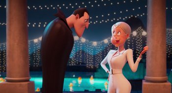 Movie still from “Hotel Transylvania 4: Transformania” (2022), directed by Jennifer Kluska – A man and a woman standing next to each other in front of lights; Medium shot, Over the shoulder angle