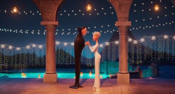 Movie still from “Hotel Transylvania 4: Transformania” (2022), directed by Jennifer Kluska – A man and a woman holding hands in front of an archway at night; Wide shot, Over the shoulder angle