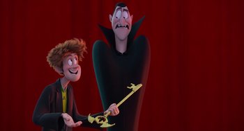 Movie still from “Hotel Transylvania 4: Transformania” (2022), directed by Jennifer Kluska – Two animated characters one of which is holding a wand; Medium shot, Over the shoulder angle