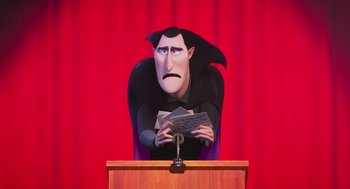 Movie still from “Hotel Transylvania 4: Transformania” (2022), directed by Jennifer Kluska – A cartoon of a man in a dracula costume holding a piece of paper in front of him; Medium shot, Low angle