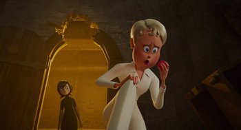 Movie still from “Hotel Transylvania 4: Transformania” (2022), directed by Jennifer Kluska – A woman is standing next to an animated character; Medium shot, Low angle