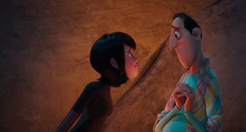Movie still from “Hotel Transylvania 4: Transformania” (2022), directed by Jennifer Kluska – A woman and a man standing next to each other; Medium shot, Over the shoulder angle