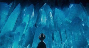 Movie still from “Hotel Transylvania 4: Transformania” (2022), directed by Jennifer Kluska – A person standing in front of a cave filled with ice; Extreme Wide shot, Low angle