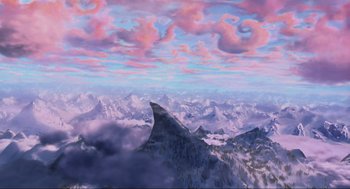 Movie still from “How the Grinch Stole Christmas” (2000), directed by Ron Howard – A painting of a mountain range with clouds in the background; Extreme Wide shot, Overhead angle