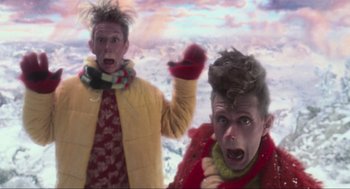 Movie still from “How the Grinch Stole Christmas” (2000), directed by Ron Howard – Two men in winter clothing one of which is wearing a scarf and one of which is wearing a hat; Close Up shot, Low angle