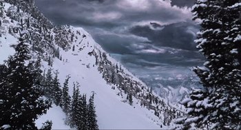 Movie still from “How the Grinch Stole Christmas” (2000), directed by Ron Howard – A snowy mountain with trees on the side of it; Extreme Wide shot, Low angle