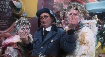 Movie still from “How the Grinch Stole Christmas” (2000), directed by Ron Howard – A group of people dressed up in costumes; Close Up shot, Low angle
