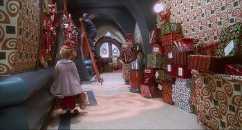 Movie still from “How the Grinch Stole Christmas” (2000), directed by Ron Howard – A room filled with lots of christmas presents; Wide shot, High angle