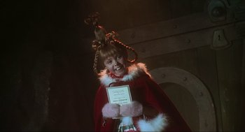 Movie still from “How the Grinch Stole Christmas” (2000), directed by Ron Howard – A young girl dressed up as little red riding hood; Close Up shot, Low angle