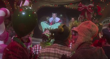 Movie still from “How the Grinch Stole Christmas” (2000), directed by Ron Howard – A group of people dressed up in costumes and hats; Medium shot, Over the shoulder angle