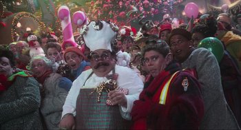 Movie still from “How the Grinch Stole Christmas” (2000), directed by Ron Howard – A group of people dressed up in costumes for christmas; Medium shot, Over the shoulder angle