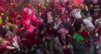 Movie still from “How the Grinch Stole Christmas” (2000), directed by Ron Howard – A group of people gathered together in a room; Extreme Wide shot, Overhead angle