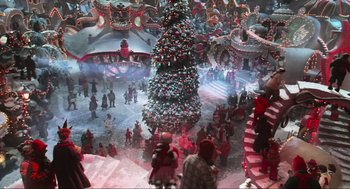 Movie still from “How the Grinch Stole Christmas” (2000), directed by Ron Howard – A crowd of people standing around a christmas tree; Extreme Wide shot, High angle