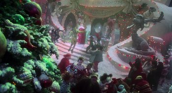Movie still from “How the Grinch Stole Christmas” (2000), directed by Ron Howard – A group of people standing in a room with lights on; Extreme Wide shot, High angle