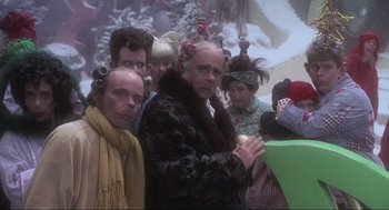 Movie still from “How the Grinch Stole Christmas” (2000), directed by Ron Howard – A group of people with curlers in their hair; Medium shot, Low angle