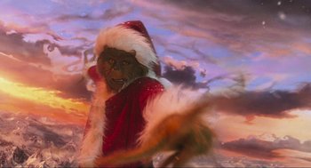 Movie still from “How the Grinch Stole Christmas” (2000), directed by Ron Howard – A person dressed up as the grinch in front of a sky background; Close Up shot, High angle