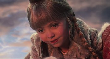 Movie still from “How the Grinch Stole Christmas” (2000), directed by Ron Howard – A little girl with long brown hair and blue eyes; Close Up shot, High angle