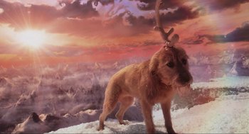 Movie still from “How the Grinch Stole Christmas” (2000), directed by Ron Howard – A dog with antlers standing on top of a hill; Wide shot, High angle