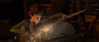 Movie still from “How to Train Your Dragon” (2010), directed by Chris Sanders – A young boy is holding a saw in his hand; Medium shot, Low angle