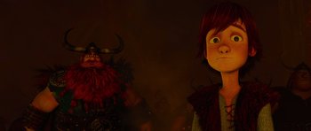 Movie still from “How to Train Your Dragon” (2010), directed by Chris Sanders – A statue of a man and a woman; Medium shot, Low angle