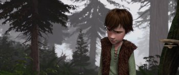 Movie still from “How to Train Your Dragon” (2010), directed by Chris Sanders – A young boy in a brown vest in the woods; Medium shot, High angle