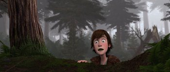 Movie still from “How to Train Your Dragon” (2010), directed by Chris Sanders – A cartoon of a boy looking over a hill; Medium shot, Low angle