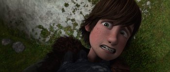 Movie still from “How to Train Your Dragon” (2010), directed by Chris Sanders – A person's face in a scene from a movie; Close Up shot, Overhead angle
