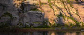 Movie still from “How to Train Your Dragon” (2010), directed by Chris Sanders – A man standing in front of a rock wall; Extreme Wide shot, High angle