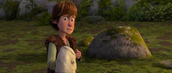 Movie still from “How to Train Your Dragon” (2010), directed by Chris Sanders – A young boy is holding something in his hand; Medium shot, High angle