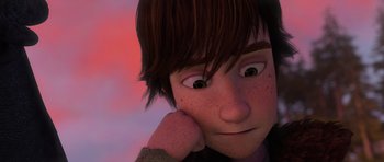 Movie still from “How to Train Your Dragon” (2010), directed by Chris Sanders – A person with his hand under his chin; Close Up shot, Low angle