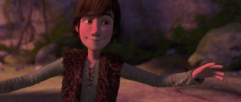Movie still from “How to Train Your Dragon” (2010), directed by Chris Sanders – A young boy with a brown fur vest and a brown shirt; Medium shot, Low angle