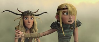 Movie still from “How to Train Your Dragon” (2010), directed by Chris Sanders – A couple of people that are standing up together; Medium shot, Low angle