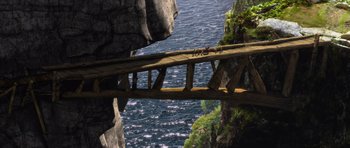 Movie still from “How to Train Your Dragon” (2010), directed by Chris Sanders – An image of a bridge over the water; Extreme Wide shot, High angle