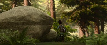 Movie still from “How to Train Your Dragon” (2010), directed by Chris Sanders – A person walking in the woods near a large rock; Extreme Wide shot, Low angle