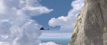Movie still from “How to Train Your Dragon” (2010), directed by Chris Sanders – A dragon flying over a cliff on a cloudy day; Extreme Wide shot, High angle
